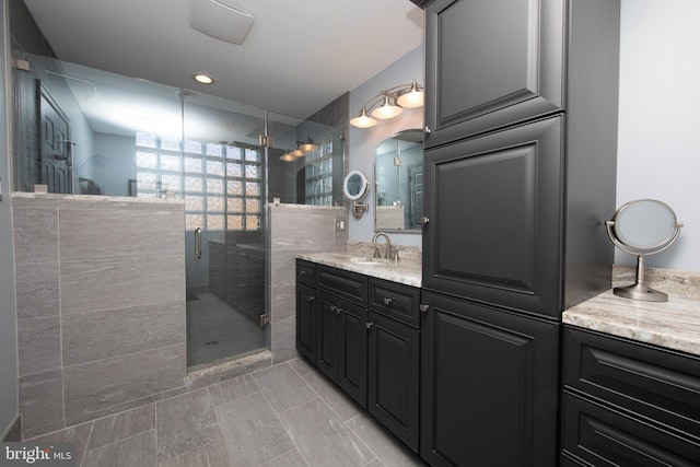 bathroom with vanity and walk in shower