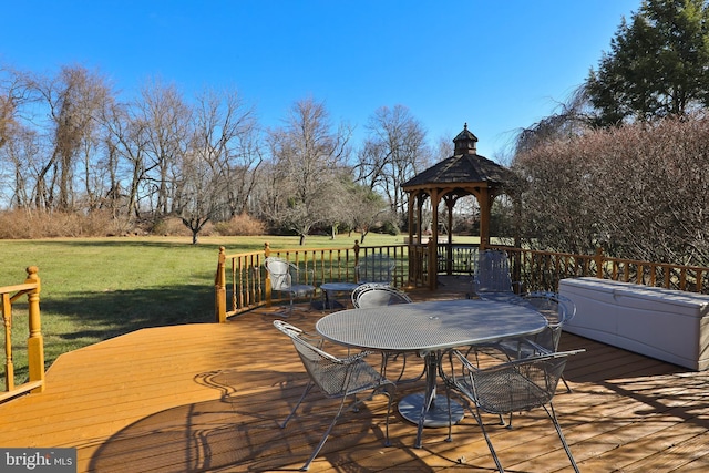 wooden deck with a gazebo and a lawn