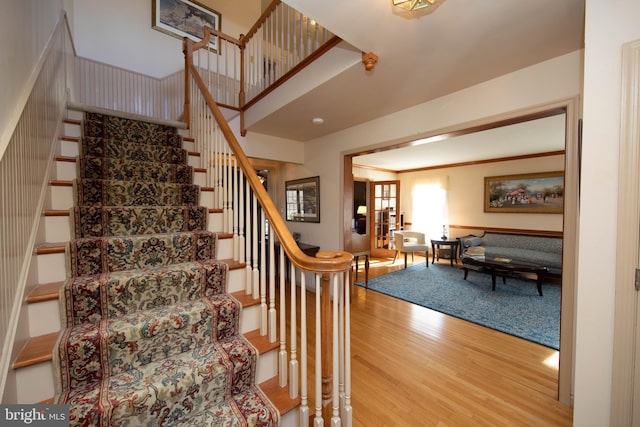 stairs featuring hardwood / wood-style flooring