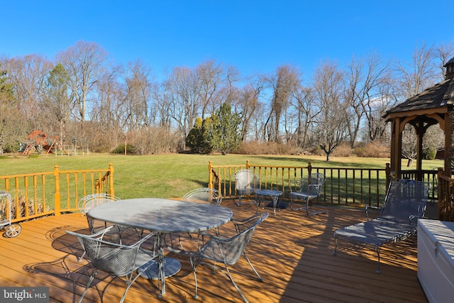 deck featuring a gazebo and a yard