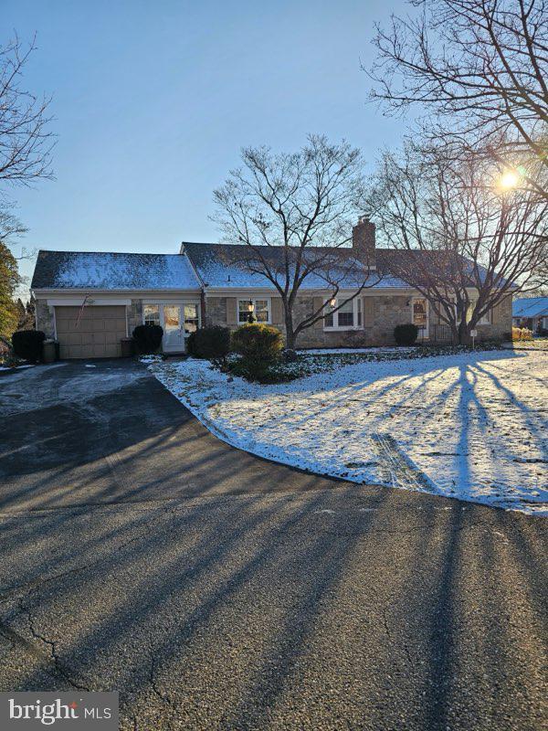 ranch-style house featuring a garage