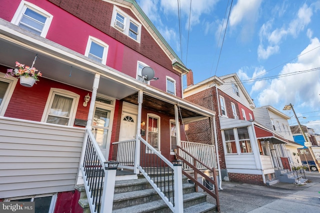 47 Liberty St, Trenton, NJ 08611 - view of property featuring a porch and brick siding