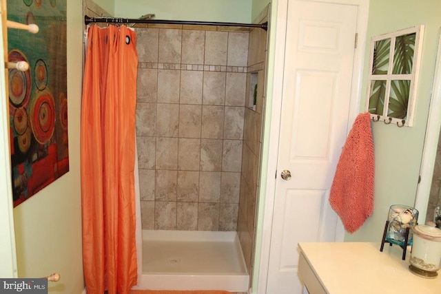 bathroom with vanity and walk in shower