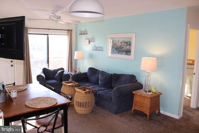 living room featuring carpet flooring and ceiling fan