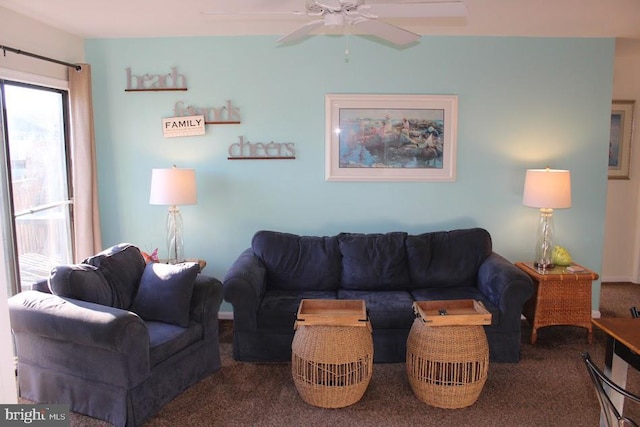 living room featuring carpet flooring and ceiling fan