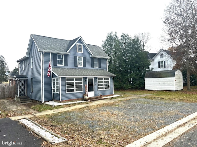 front facade featuring a shed