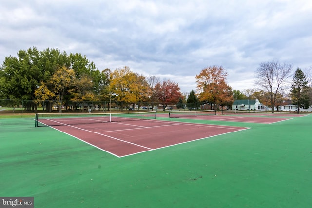 view of tennis court featuring basketball court