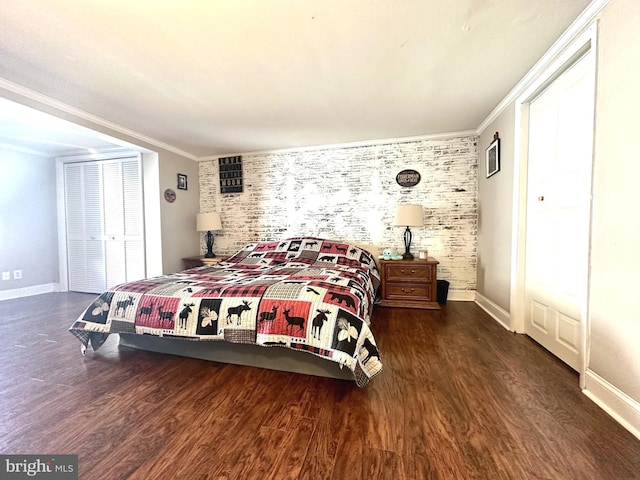 bedroom with crown molding and dark wood-type flooring