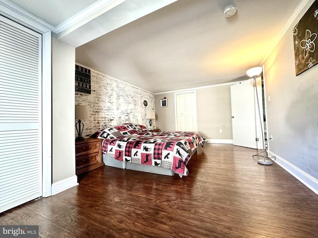 bedroom with crown molding and dark wood-type flooring