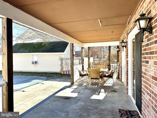 view of patio with a swimming pool