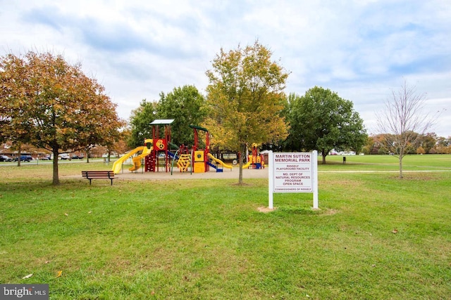 view of playground with a lawn