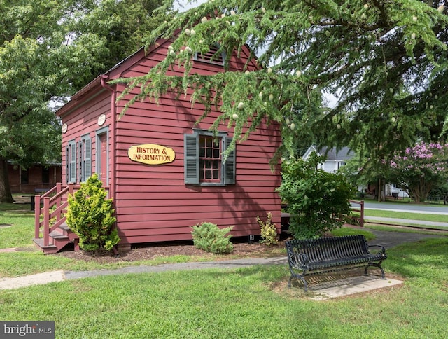 view of home's exterior with a yard