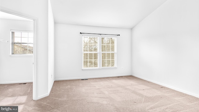 spare room with light colored carpet