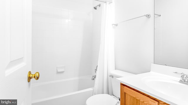 full bathroom featuring vanity, shower / tub combo with curtain, and toilet