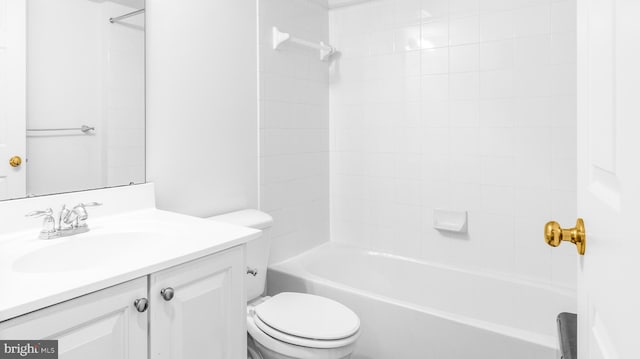 full bathroom with vanity, toilet, and tiled shower / bath combo