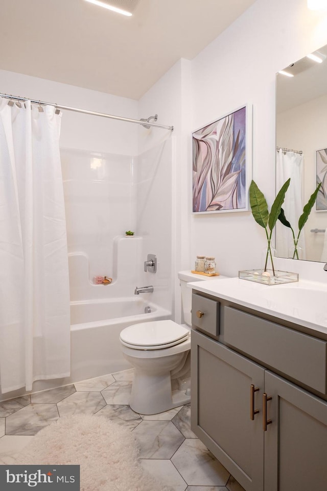 full bathroom featuring shower / bath combo, toilet, and vanity