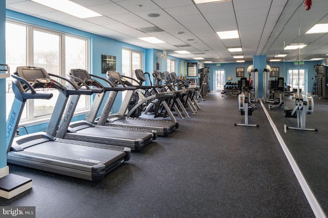 workout area with a paneled ceiling