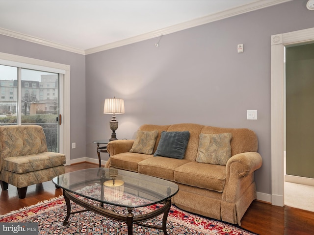 living room with dark hardwood / wood-style flooring and ornamental molding