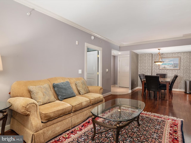 living room with hardwood / wood-style flooring and ornamental molding