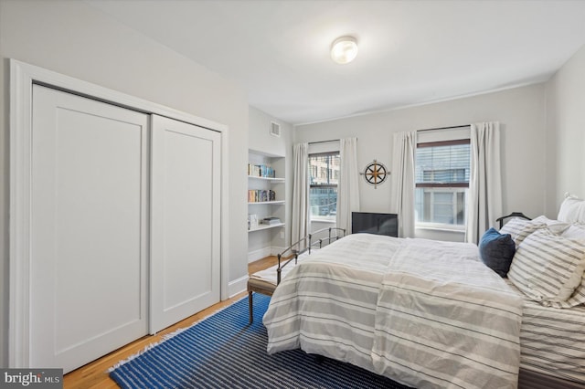 bedroom featuring a closet and wood-type flooring