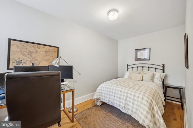 bedroom featuring hardwood / wood-style flooring