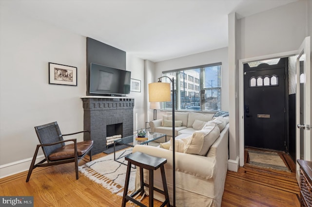 living room featuring a fireplace and hardwood / wood-style floors