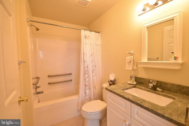 full bathroom with tile patterned floors, vanity, shower / tub combo, and toilet