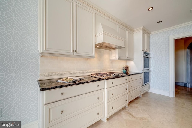 kitchen featuring custom exhaust hood, crown molding, decorative backsplash, dark stone countertops, and stainless steel appliances