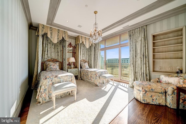 bedroom with access to exterior, hardwood / wood-style floors, a chandelier, and ornamental molding