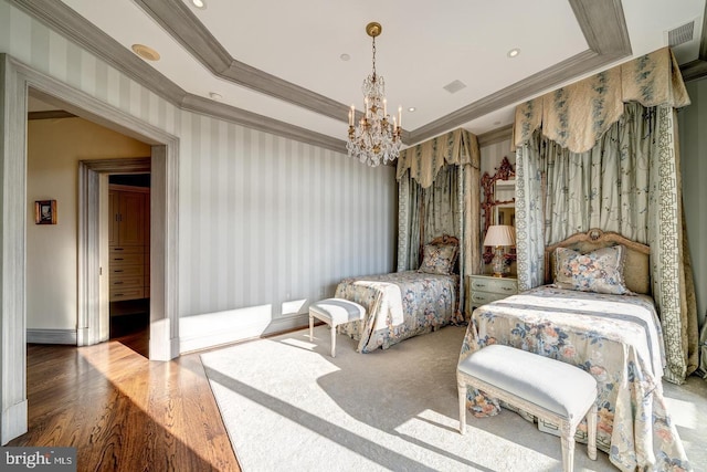 bedroom with hardwood / wood-style floors, a notable chandelier, and crown molding