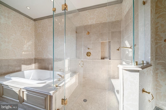 bathroom with ornamental molding and independent shower and bath