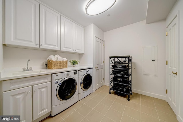 laundry room with sink, cabinets, electric panel, light tile patterned flooring, and washer and dryer