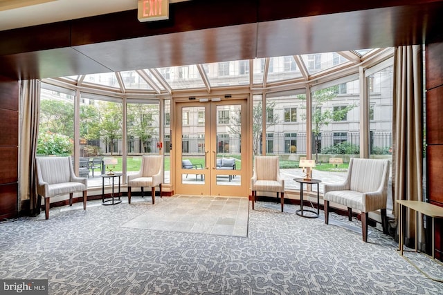 sunroom / solarium featuring plenty of natural light and french doors