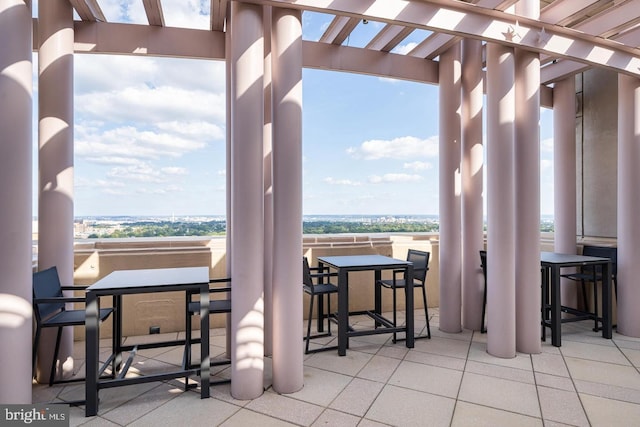 balcony featuring a pergola