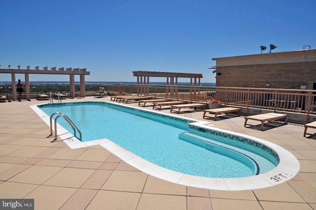 view of pool with a patio and a pergola