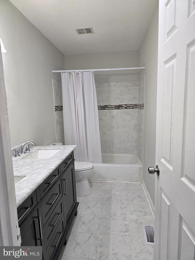 full bathroom featuring shower / bath combination with curtain, vanity, and toilet