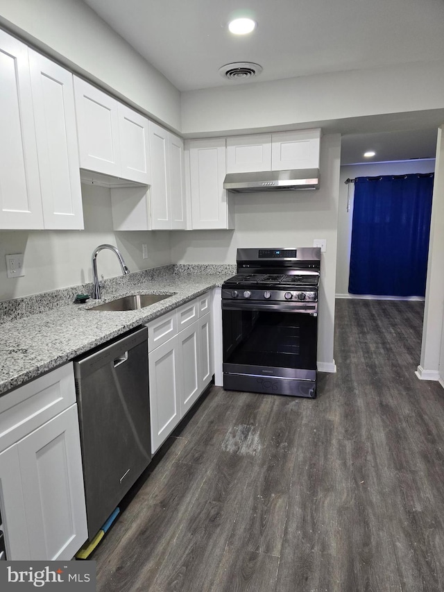 kitchen with gas range, sink, stainless steel dishwasher, and white cabinets