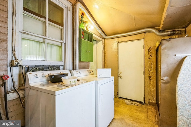 washroom featuring washer and clothes dryer