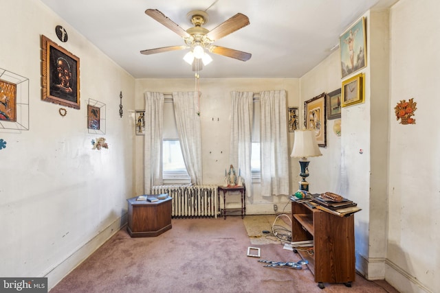 miscellaneous room with carpet, radiator heating unit, and ceiling fan