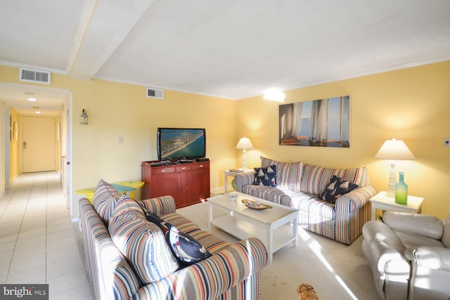 living room with crown molding and light tile patterned flooring