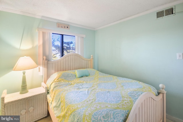 bedroom featuring crown molding and a textured ceiling