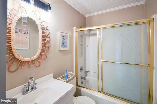 full bathroom with combined bath / shower with glass door, ornamental molding, vanity, toilet, and a textured ceiling