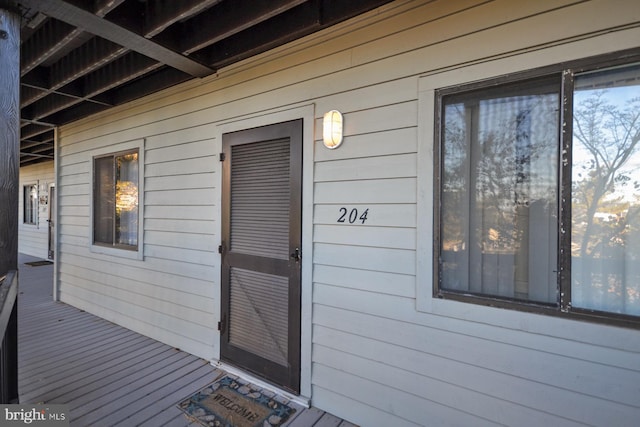 property entrance with a deck