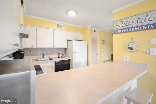 kitchen with sink, black dishwasher, white refrigerator, white cabinets, and kitchen peninsula