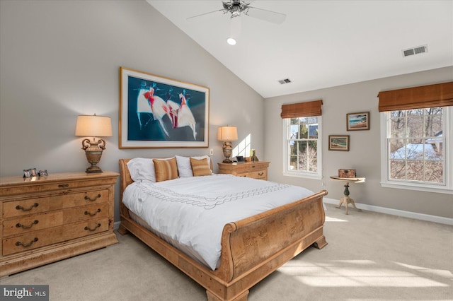 bedroom featuring ceiling fan, vaulted ceiling, and light carpet