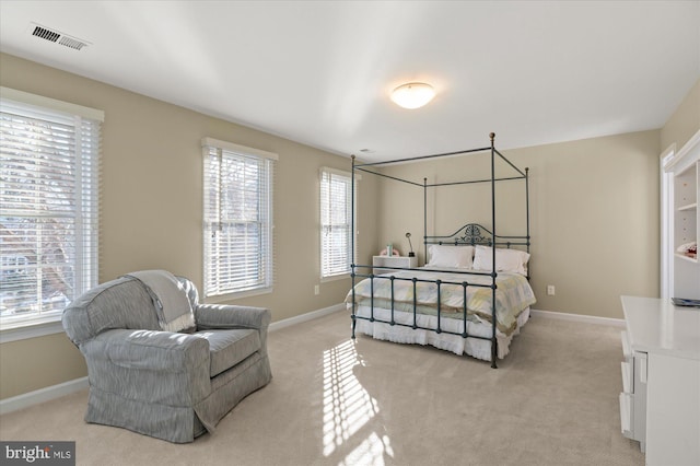 bedroom with light colored carpet