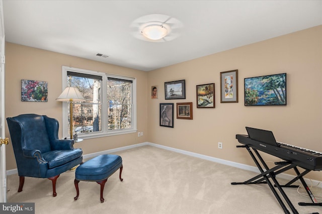 living area featuring light colored carpet