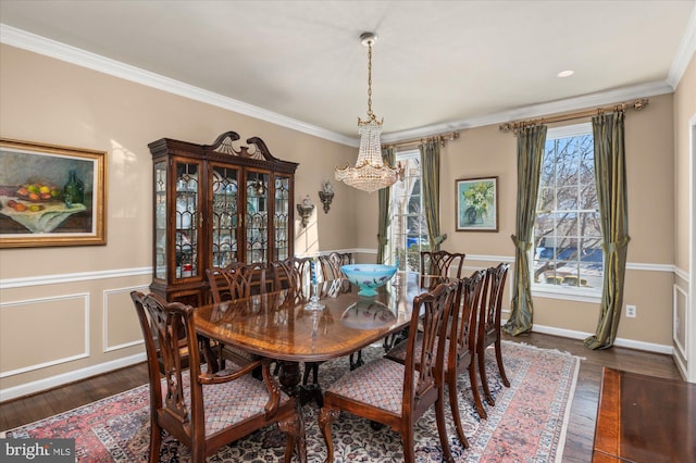 dining area with crown molding and dark hardwood / wood-style floors