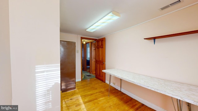 mudroom featuring light wood-style flooring and visible vents