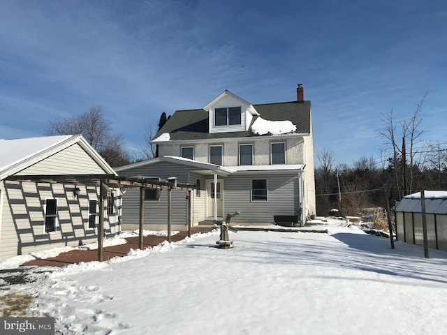 view of front of home with a chimney